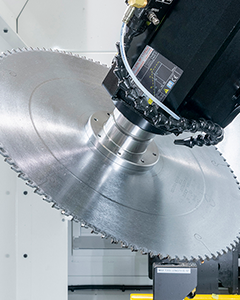 Close-up of a 400mm circular saw blade used on C.R. Onsrud CNC machines for precision cutting of various materials.