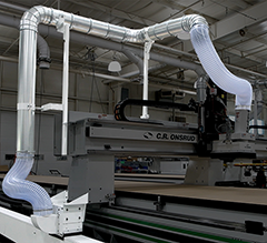 Floating duct system connected to a C.R. Onsrud CNC machine for efficient dust collection.